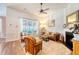 Comfortable living room featuring a fireplace, ample seating, and a large window with natural light at 422 Cabrill Dr, Charleston, SC 29414