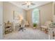 Bright office space with neutral walls, white trim, and a large window allowing for lots of natural light at 422 Cabrill Dr, Charleston, SC 29414