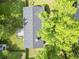 Overhead view of backyard shows the deck and the spacious yard, framed by mature trees, enhancing its tranquil ambiance at 5 Drummond Ct, Charleston, SC 29414