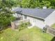 Aerial view shows backyard with deck, lawn, and mature trees, creating a private oasis at 5 Drummond Ct, Charleston, SC 29414