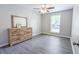 Bright bedroom featuring a large window and wood-look flooring at 5 Drummond Ct, Charleston, SC 29414