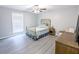 Inviting bedroom offers wood-look flooring and neutral color palette at 5 Drummond Ct, Charleston, SC 29414