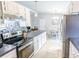 Bright kitchen with modern appliances, countertop space and view into the dining room at 5 Drummond Ct, Charleston, SC 29414