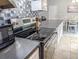 Modern kitchen equipped with stainless steel appliances and view into the dining room at 5 Drummond Ct, Charleston, SC 29414