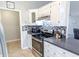 This modern kitchen is equipped with stainless steel appliances and beautiful backsplash at 5 Drummond Ct, Charleston, SC 29414