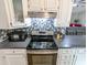 Modern kitchen featuring stainless steel appliances, stylish backsplash and bright cabinets at 5 Drummond Ct, Charleston, SC 29414