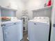 Efficient laundry room equipped with a washer, dryer, and water heater at 5 Drummond Ct, Charleston, SC 29414