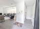 Inviting open-concept living space features gray flooring, neutral paint and an abundance of natural light at 5 Drummond Ct, Charleston, SC 29414