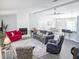 Open concept living room featuring a decorative fireplace, ceiling fan and stylish furniture at 5 Drummond Ct, Charleston, SC 29414