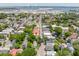 Scenic aerial view with colorful houses, lush greenery and distant views of the bridge and harbor at 50 South St, Charleston, SC 29403