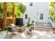 Charming backyard patio with outdoor seating and lush tropical landscaping at 50 South St, Charleston, SC 29403