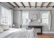 Bright bedroom with hardwood floors, large windows, and elegant decor, creating a serene and inviting space at 50 South St, Charleston, SC 29403