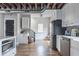 Spacious kitchen featuring stainless steel appliances, white cabinets, and hardwood floors at 50 South St, Charleston, SC 29403