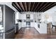Bright kitchen with stainless steel appliances, white cabinetry, and an eat-in island at 50 South St, Charleston, SC 29403