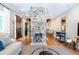 Open-concept living area features hardwood floors, a decorative brick fireplace, and comfortable seating arrangements at 50 South St, Charleston, SC 29403