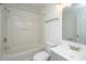 Well-lit bathroom with a shower-tub combo, updated vanity, and tile flooring at 5042 Thornton Dr, Summerville, SC 29485