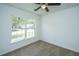 Bright bedroom featuring neutral carpet and a large window offering ample natural light at 5042 Thornton Dr, Summerville, SC 29485