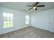 Bedroom featuring plush carpeting, ceiling fan, and window letting in natural light and neighborhood view at 5042 Thornton Dr, Summerville, SC 29485