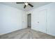 Bright bedroom with neutral carpet, ceiling fan, and white trim at 5042 Thornton Dr, Summerville, SC 29485
