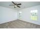 Bedroom featuring plush carpeting, ceiling fan, and window letting in natural light and neighborhood view at 5042 Thornton Dr, Summerville, SC 29485
