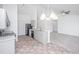 A full view of the eat-in kitchen and living room, featuring modern appliances and neutral color palette at 5042 Thornton Dr, Summerville, SC 29485