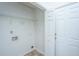 Practical laundry room features tile floor, white shelving, and washer/dryer hookups at 5042 Thornton Dr, Summerville, SC 29485