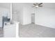 A spacious living room with modern lighting and neutral carpet, featuring a vaulted ceiling and open floorplan at 5042 Thornton Dr, Summerville, SC 29485