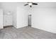 An open living room with neutral walls, carpeting, vaulted ceilings and a ceiling fan at 5042 Thornton Dr, Summerville, SC 29485