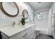 An updated bathroom features a double vanity, modern fixtures, and a shower-tub combo at 5043 Victoria Ave, North Charleston, SC 29405