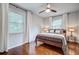 A bright bedroom features hardwood floors, neutral walls, and large windows with natural light at 5043 Victoria Ave, North Charleston, SC 29405