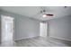 Relaxing bedroom with a ceiling fan and gray wood flooring, offering a peaceful retreat at 5043 Victoria Ave, North Charleston, SC 29405