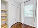 A cozy bedroom with natural light, hardwood floors, and a convenient closet at 5043 Victoria Ave, North Charleston, SC 29405