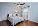 A sunny bedroom with hardwood floors and a large window offers a comfortable and inviting space at 5043 Victoria Ave, North Charleston, SC 29405