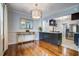 Dining room with hardwood floors, open to kitchen and stainless steel appliances at 5043 Victoria Ave, North Charleston, SC 29405