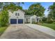 Charming two-story home with a two-car garage, well-manicured lawn, and inviting curb appeal at 5043 Victoria Ave, North Charleston, SC 29405