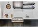A modern kitchen boasts stainless steel appliances, sleek black cabinets, and stylish countertops at 5043 Victoria Ave, North Charleston, SC 29405