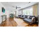 Sun-lit living room featuring hardwood floors, neutral walls, and a comfortable sectional sofa at 5043 Victoria Ave, North Charleston, SC 29405