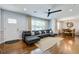 Comfortable living area featuring hardwood floors, neutral walls, and an open floor plan at 5043 Victoria Ave, North Charleston, SC 29405