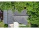 Aerial view of a well-maintained roof surrounded by lush trees and a neatly kept yard at 5043 Victoria Ave, North Charleston, SC 29405