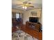 Cozy living room with ceiling fan, hardwood floors, and view into the dining room at 505 Blacks St, Walterboro, SC 29488