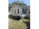 Side exterior view showing fenced yard and access to the home's foundation at 505 Blacks St, Walterboro, SC 29488