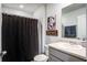 Bathroom featuring a shower with a curtain, white vanity, framed mirror, and essential toiletries at 510 Shady Maple St, Moncks Corner, SC 29461