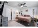 Bedroom featuring a queen bed, ceiling fan, and easy access to the walk-in closet and en-suite bathroom at 510 Shady Maple St, Moncks Corner, SC 29461