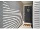 Welcoming front entrance with a dark-colored door, decorative wreath, and a neutral-toned doormat at 510 Shady Maple St, Moncks Corner, SC 29461