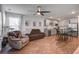 Open living area features wood floors, comfortable seating, and adjacent kitchen; bright and inviting at 510 Shady Maple St, Moncks Corner, SC 29461