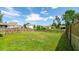 Spacious backyard featuring lush greenery and playground at 5138 Preserve Blvd, Ladson, SC 29456