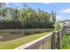 Scenic view of the backyard pond surrounded by lush trees at 5138 Preserve Blvd, Ladson, SC 29456