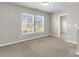 Well-lit bedroom featuring two bright windows and a walk-in closet at 5138 Preserve Blvd, Ladson, SC 29456