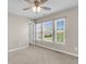 Bedroom with carpet, ceiling fan, three windows letting in bright natural light at 5138 Preserve Blvd, Ladson, SC 29456