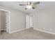 Bright bedroom with ceiling fan, neutral walls and carpet, and two closets at 5138 Preserve Blvd, Ladson, SC 29456